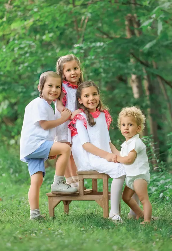 Four siblings on a bench in the woods, outdoor family photography by Photoholic, Rockland County NY